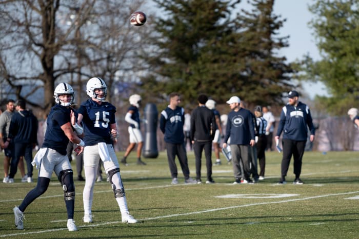 Penn State quarterbacks Drew Allar (15) and Beau Pribula go through drills during the first day of spring practice in State College.